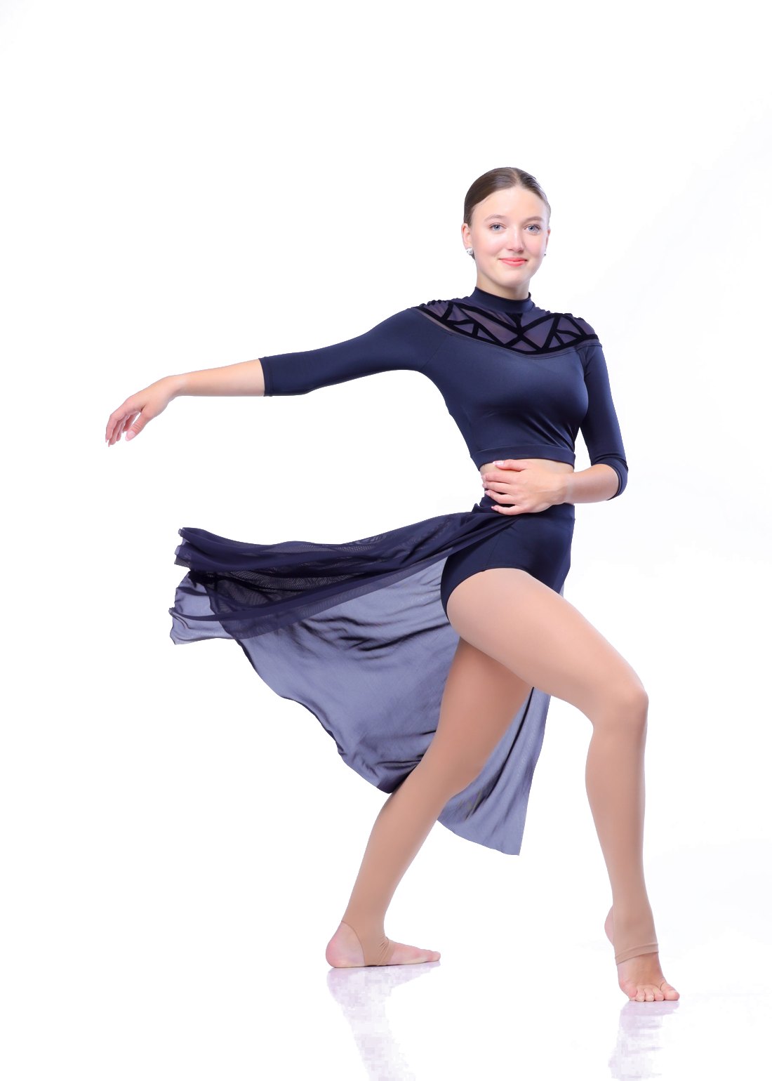 Picture day portrait of a dancer in a navy lyrical costume on a white backdrop